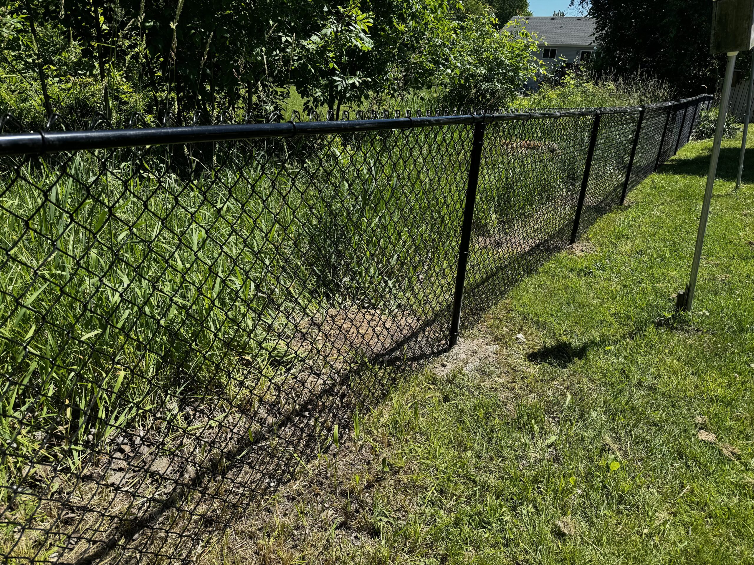 Residential chain link fence installation.
