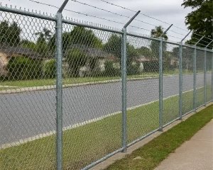 no climb chain link security fence installation by road